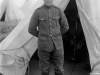 Soldier standing at entrance to tent