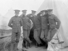 Group of soldiers standing at entrance to tent