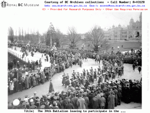 The 30th Battalion marches past the Legislature on its way to the harbour to embark for overseas service. Permission to use this image must be obtained from the BC Archives.  Source: Image Courtesy of Royal BC Museum, BC Archives - Call Number: A-03128 See BC Archives  Date: 14 February 1915